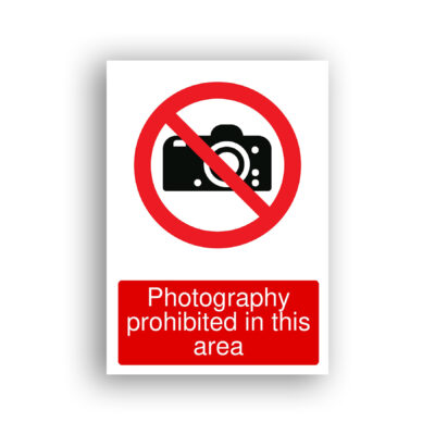 Photography Prohibited in This Area prohibition sign safety sign with a black DSLR camera silhouette inside a red prohibition circle with a diagonal red bar across it.