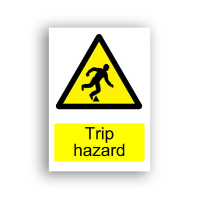 Trip Hazard warning sign safety sign with black silhouette of a person stumbling forward over a small raised obstacle, set within a yellow warning triangle with black border.